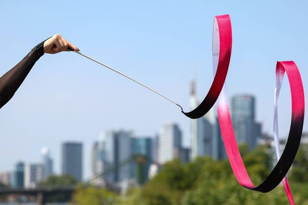 Frankfurt am Main, July 30, 2026: symbolic photo of gymnastics, Frankfurt Skyline during a media day from Deutscher Turner-Bund (DTB) ahead of the Rhythmic gymnastics, Rhythmische Sportgymnastik, RSG World Championships at Festhalle Frankfurt (Aug. 12 16.2026) *** Frankfurt am Main, July 30, 2026: A symbolic photo of gymnastics and the Frankfurt skyline taken during a media day hosted by the German Gymnastics Federation (DTB) ahead of the Rhythmic Gymnastics World Championships at the Festhalle Frankfurt, August 12–16, 2026 Copyright: HMBxMedia JoaquimxFerreira