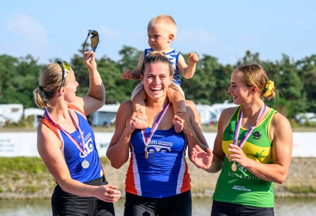 Czech Championships in Racice, July 30, 2026. K1 500 m Women category. From left the second placed Barbora Sovova, winner Anezka Paloudova with her son Jonatan and the third placed Zuzana Hanusova. (CTKxPhoto OndrejxHajek) CTKPhotoP2026073007383  CTKPhotoP2026073007383