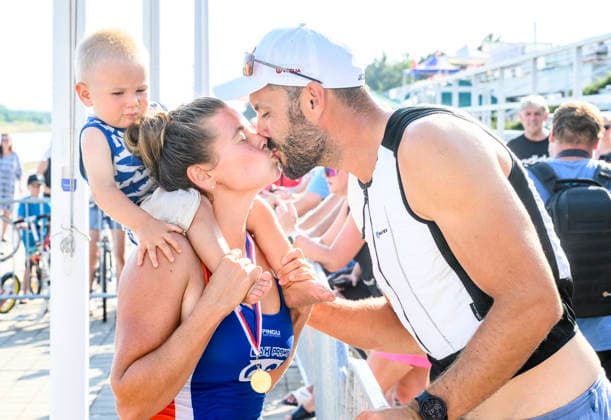 Czech Championships in Racice, July 30, 2026. K1 500 m Women category winner Anezka Paloudova and K1 1000 m Men category winner Josef Dostal with their son Jonatan. (CTKxPhoto OndrejxHajek) CTKPhotoP2026073007395  CTKPhotoP2026073007395