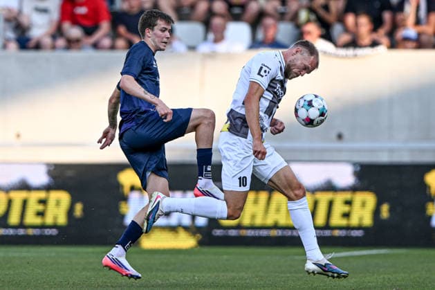L-R Sander Havik Innvaer of Tromso IL and Mick van Buren of Hradec Kralove in action during the second leg of the Europa League second qualifying round between FC Hradec Kralove and Tromso IL, Hradec Kralove, July 30, 2026. (CTKxPhoto DavidxTanecek) CTKPhotoP2026073007771  CTKPhotoP2026073007771
