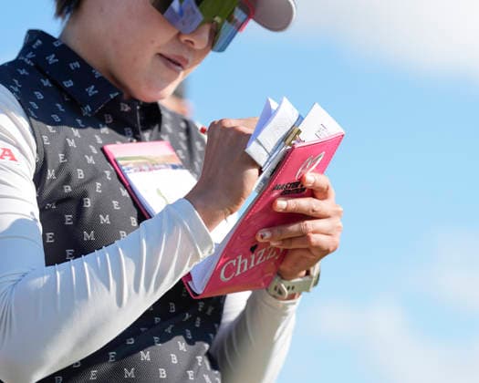 LYTHAM, ENGLAND - JULY 30: Chizzy Iwai (JPN) marks her card as she walks from the eighteenth tee during Round 1 at the 50th AIG Women™s Open Championship at the Royal Lytham and St Anne™s Golf Club, Lytham on July 30, 2026 in Lancashire, England The 50th AIG Women™s Open Championship