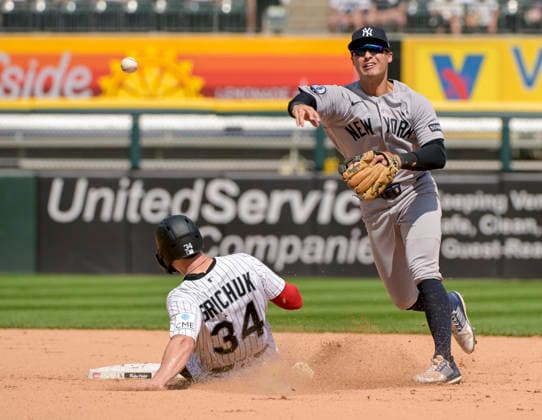 New York Yankees shortstop Anthony Volpe (11) turns the double play on Chicago White Sox Randal Grichuk (34) during the sixth inning at Rate Field in Chicago, IL on Thursday, July 30, 2026. The White Sox defeated the Yankees 2-1.  CHI20260730116 MARKxBLACK