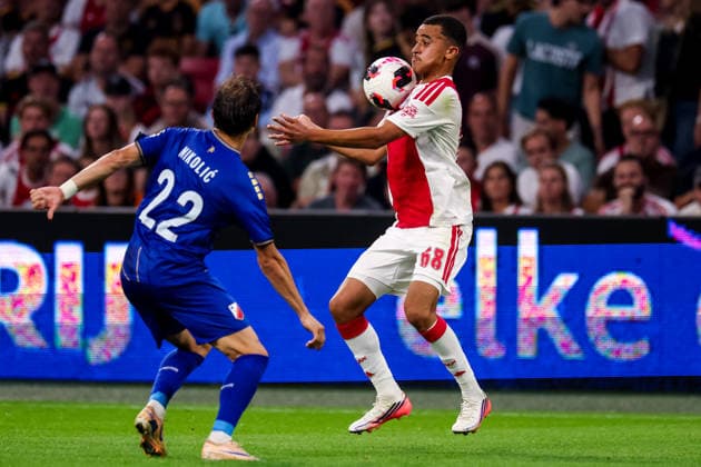 AMSTERDAM, NETHERLANDS - JULY 30: Abdellah Ouazane of AFC Ajax controls the ball under pressure from Lazar Nikolic of FK Vojvodina during the UEFA Conference League 2026 27 second qualifying round second leg match between AFC Ajax and at Johan Cruijff Arena on July 30, 2026 in Amsterdam, Netherlands.  Copyright: xRenexNijhuis MBxMediax