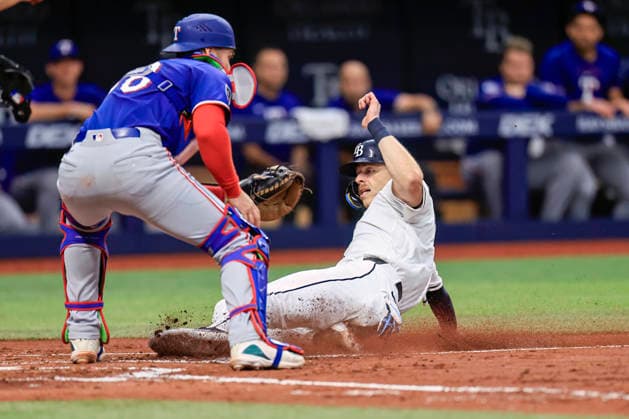 July 30, 2026, St. Petersburg, Florida, USA: Tampa Bay Rays catcher HUNTER FEDUCCIA (9) slides safely at home and scores the first run on a single by designated hitter Yandy DoÂ­az (2) during an MLB, Baseball Herren, USA game against the Texas Rangers at Tropicana Field. The Rays beat the Rangers 3-2 and won the series. St. Petersburg USA - ZUMAh180 20260730_zsp_h180_076 Copyright: xKimxHukarix