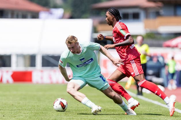 ST. JOHANN IN TIROL, AUSTRIA - JULY 31: Reigan Heskey (1. FC Koeln, 11) controls the ball against Julian Eitschberger (Hertha BSC Berlin, 2) during a friendly game between 1. FC Koeln vs. Hertha BSC Berlin at trainings camp of 1. FC Koeln in Kitzbuehel of season 2026 27 at Koasastadion on July 31, 2026 in St. Johann in Tirol, Austria. Austria Copyright: xSteffiexWunderlx