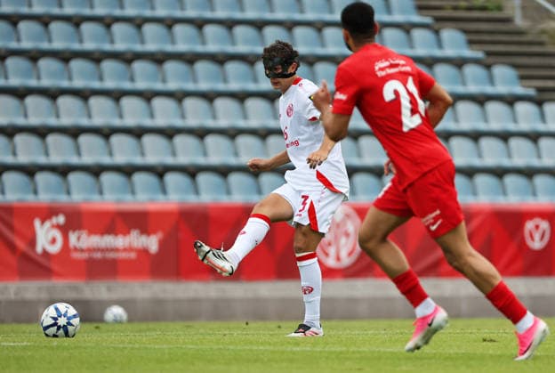 SOCCER - Mainz vs Al-Ahli, test match KUFSTEIN,AUSTRIA,31.JUL.26 - SOCCER - 1. DFL, 1. Deutsche Bundesliga, UAE Pro League, 1. FSV Mainz 05 vs Shabab Al-Ahli, test match. Image shows Fabio Gruber (Mainz) and Sultan Adill (Shabab Al-Ahli).  GEPAxpictures xThomasxBachun