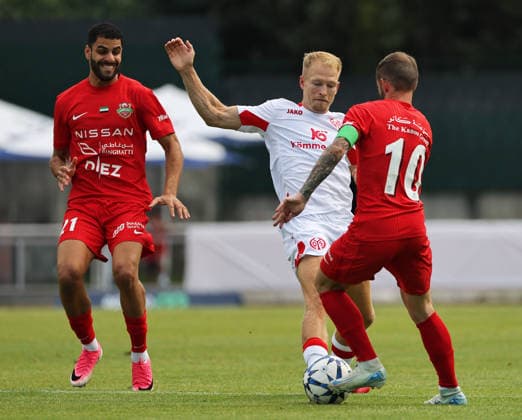 SOCCER - Mainz vs Al-Ahli, test match KUFSTEIN,AUSTRIA,31.JUL.26 - SOCCER - 1. DFL, 1. Deutsche Bundesliga, UAE Pro League, 1. FSV Mainz 05 vs Shabab Al-Ahli, test match. Image shows Sultan Adill (Shabab Al-Ahli), Andreas Hanche Olsen (Mainz) and Federico Nicolas Cartabia (Shabab Al-Ahli).  GEPAxpictures xThomasxBachun