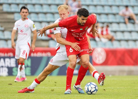 SOCCER - Mainz vs Al-Ahli, test match KUFSTEIN,AUSTRIA,31.JUL.26 - SOCCER - 1. DFL, 1. Deutsche Bundesliga, UAE Pro League, 1. FSV Mainz 05 vs Shabab Al-Ahli, test match. Image shows Andreas Hanche Olsen (Mainz) and Saeid Ezatolahi (Shabab Al-Ahli).  GEPAxpictures xThomasxBachun