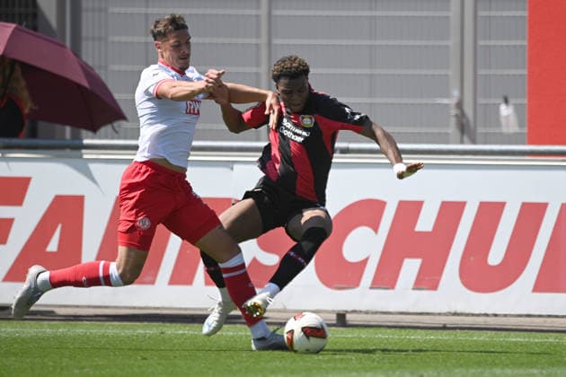 Axel TAPE (LEV) gegen Luca BAZZOLI (RWE) Aktion, Zweikampf, Fussball 1. Bundesliga, Testspiel, testmatch, friendly match, Freundschaftsspiel, Bayer Leverkusen (LEV) - Rot Weiss Essen 3-0, am 01.08.2026 in Leverkusen Deutschland. DFL regulations prohibit any use of photographs as image sequences and or quasi-video Â *** Axel TAPE LEV vs. Luca BAZZOLI RWE Action, Tackle, Soccer, Bundesliga 1, Friendly Match, Bayer Leverkusen (LEV) vs. Rot-Weiss Essen 3–0, on August 1, 2026, in Leverkusen, Germany. DFL regulations prohibit any use of photographs as image sequences and or quasi-video.