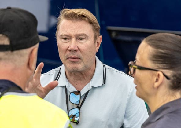 Former Finnish race car driver and Formula 1 pilot Mika Hakkinen (center) at the pit area in Most, where their daughter Ella will be competing in a formula 4 race, on August 1, 2026. Snapshots from the afternoon before the race. (CTKxPhoto VojtechxHajek) CTKPhotoF202608010000201  CTKPhotoF202608010000201