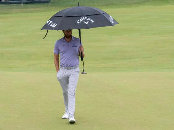 DETROIT, MI - AUGUST 01: Chris Kirk (USA) caries an umbrella onto the 14th green during the third round of the Rocket Classic at Detroit Golf Club on August 01, 2026, in Detroit, Michigan. (Photo by Joseph Weiser Icon Sportswire) GOLF: AUG 01 PGA, Golf Herren Rocket Classic EDITORIAL USE ONLY Icon2608010723
