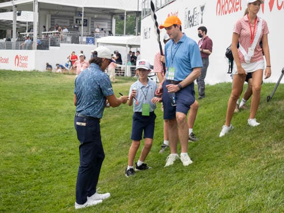 DETROIT, MI - AUGUST 01: Rickie Fowler (USA) signs autographs a young fan after completing the third round of the Rocket Classic at Detroit Golf Club on August 01, 2026, in Detroit, Michigan. (Photo by Joseph Weiser Icon Sportswire) GOLF: AUG 01 PGA, Golf Herren Rocket Classic EDITORIAL USE ONLY Icon2608010853