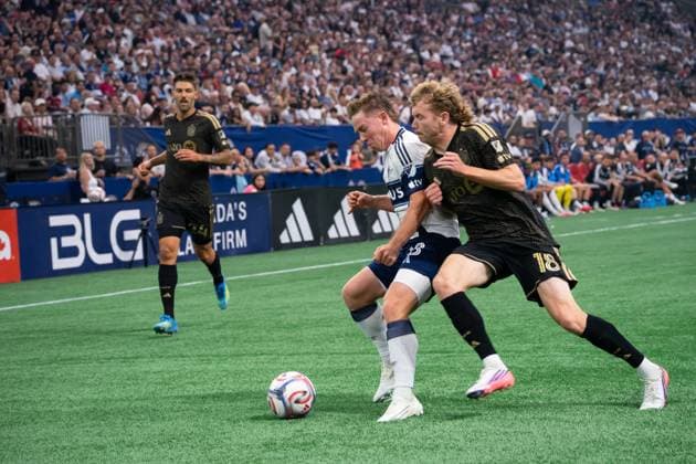 VANCOUVER, CANADA - AUGUST 1: Tate Johnson of Vancouver Whitecaps FC and Jacob Shaffelburg of Los Angeles FC battles for the ball during the Major League Soccer match between Vancouver Whitecaps FC and Los Angeles FC at BC Place Stadium on August 1, 2026 in Vancouver, British Columbia, Canada.  Copyright: xAmyxElle SPPx Sportspressphoto_SPR199346