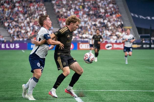 VANCOUVER, CANADA - AUGUST 1: Tate Johnson of Vancouver Whitecaps FC and Jacob Shaffelburg of Los Angeles FC battles for the ball during the Major League Soccer match between Vancouver Whitecaps FC and Los Angeles FC at BC Place Stadium on August 1, 2026 in Vancouver, British Columbia, Canada.  Copyright: xAmyxElle SPPx Sportspressphoto_SPR199351