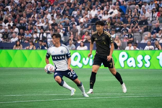 VANCOUVER, CANADA - AUGUST 1: Andres Cubas of Vancouver Whitecaps FC controls the ball while Heung Min Son of Los Angeles FC follows closely during the Major League Soccer match between Vancouver Whitecaps FC and Los Angeles FC at BC Place Stadium on August 1, 2026 in Vancouver, British Columbia, Canada.  Copyright: xAmyxElle SPPx Sportspressphoto_SPR199349
