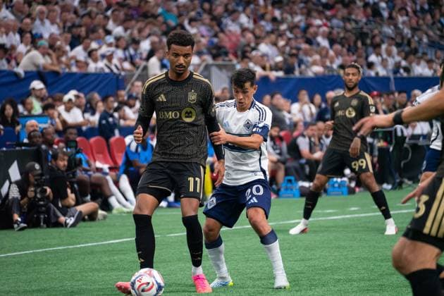 VANCOUVER, CANADA - AUGUST 1: Timothy Tillman of Los Angeles FC controls the ball while Andres Cubas of Vancouver Whitecaps FC follows closely during the Major League Soccer match between Vancouver Whitecaps FC and Los Angeles at BC Place Stadium on August 1, 2026 in Vancouver, British Columbia, Canada.  Copyright: xAmyxElle SPPx Sportspressphoto_SPR199369