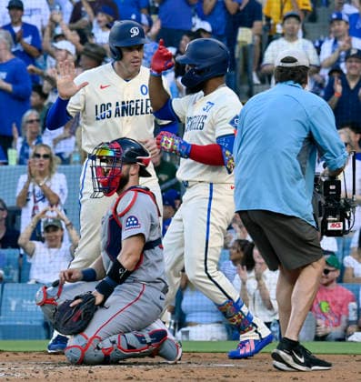 Los Angeles Dodger right fielder Teoscar Hernandez celebrates with with Freddie Freeman after hitting a two-run homer in the second inning at Dodger Stadium in Los Angeles on Saturday, August 1, 2026.  LAP2026080109 JIMxRUYMEN