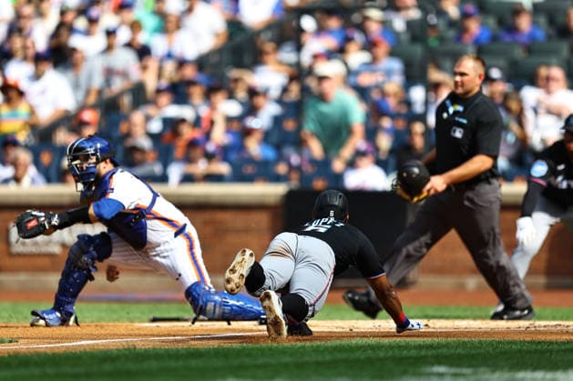 MLB, Baseball Herren, USA Miami Marlins Vs. New York Mets Miami Marlins player Otto Lopez, number 6, slides into home plate to score during the second inning of a baseball game against the New York Mets at Citi Field in Flushing, New York, on August 1, 2026. Flushing N.Y. United States  Copyright: xGordonxDonovanx originalFilename:donovan-mlbmiami260801_np0cq.jpg