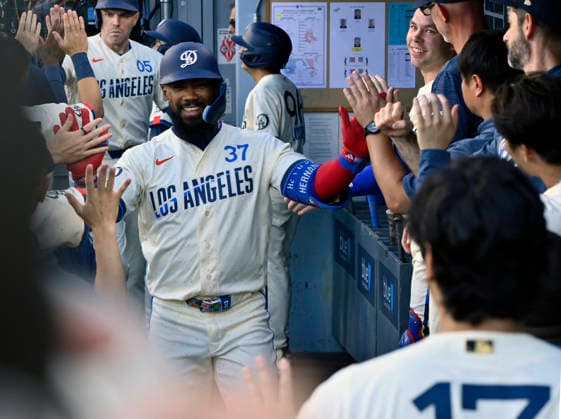 Los Angeles Dodger right fielder Teoscar Hernandez celebrates with teammates in the dugout after hitting a two-run homer in the second inning against the Boston Red Sox at Dodger Stadium in Los Angeles on Saturday, August 1, 2026.  LAP2026080111 JIMxRUYMEN