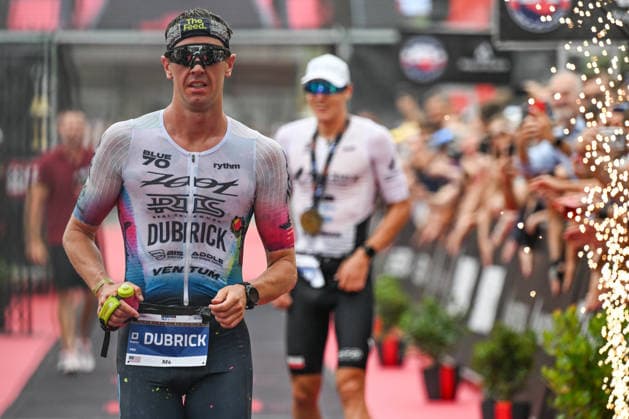 TRIATHLON: Stepniak And Bartlett Secure Elite Victories At IRONMAN 70.3 Krakow KRAKOW, POLAND - AUGUST 02: Professional triathlete Marc Dubrick of the United States crosses the finish line to secure third place in the elite professional division during the Enea IRONMAN 70.3 Krakow triathlon on the Main Market Square in Krakow, Lesser Poland Voivodeship, Poland, on August 02, 2026. Dubrick completed the podium with an official time of 3:38:22 following a 113-kilometer (70.3-mile) endurance race, with race winner Kacper Stepniak of Poland visible behind him. Krakow Poland  Copyright: xArturxWidakx originalFilename:widak-triathlo260802_np2CX.jpg