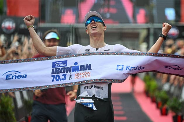 TRIATHLON: Stepniak And Bartlett Secure Elite Victories At IRONMAN 70.3 Krakow KRAKOW, POLAND - AUGUST 02: Professional triathlete Kacper Stepniak of Poland celebrates as he breaks the finish line tape to win the Enea IRONMAN 70.3 Krakow triathlon on the Main Market Square in Krakow, Lesser Poland Voivodeship, Poland, on August 02, 2026. Stepniak successfully defended his championship title, securing first place in the elite professional division with an official time of 3:36:37 following a 113-kilometer (70.3-mile) endurance race. Krakow Poland  Copyright: xArturxWidakx originalFilename:widak-triathlo260802_np8im.jpg