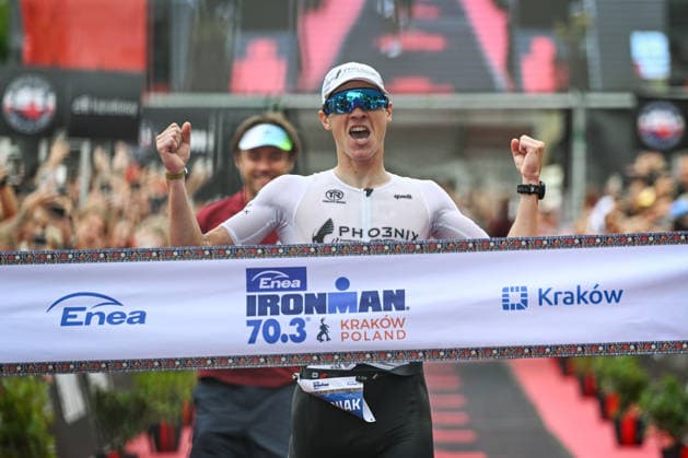 TRIATHLON: Stepniak And Bartlett Secure Elite Victories At IRONMAN 70.3 Krakow KRAKOW, POLAND - AUGUST 02: Professional triathlete Kacper Stepniak of Poland celebrates as he breaks the finish line tape to win the Enea IRONMAN 70.3 Krakow triathlon on the Main Market Square in Krakow, Lesser Poland Voivodeship, Poland, on August 02, 2026. Stepniak successfully defended his championship title, securing first place in the elite professional division with an official time of 3:36:37 following a 113-kilometer (70.3-mile) endurance race. Krakow Poland  Copyright: xArturxWidakx originalFilename:widak-triathlo260802_npUmI.jpg