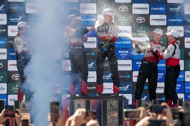 IPA87186203 - Elliott Edmondson (GBR), Marko Salminen (FIN), Sami Pajari (FIN), Elfyn Evans (GBR), and Scott Martin (GBR) celebrate their podium finishes at the FIA WRC, Motorsport Rallye, WM Secto Rally Finland in Jyväskylä, Finland, July 30–August 2, 2026.  Copyright: xFedericoxManoni IPAxSportx xx 87186203