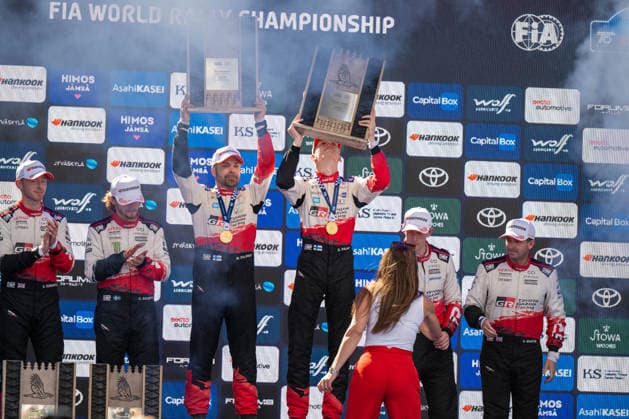 MOTORSPORTS - Rally - 2026 WRC, Motorsport Rallye, WM Rally Finland Photo by IPA ABACAPRESS.COM87186190 - Elliott Edmondson (GBR), Oliver Solberg (SWE), Marko Salminen (FIN), Sami Pajari (FIN), Elfyn Evans (GBR), and Scott Martin (GBR) celebrate on the podium at the FIA WRC SECTO RALLY FINLAND in Jyväskylä, Finland, July 30–August 2, 2026. Finland Finland  Copyright: xIPAxSport ABACAx