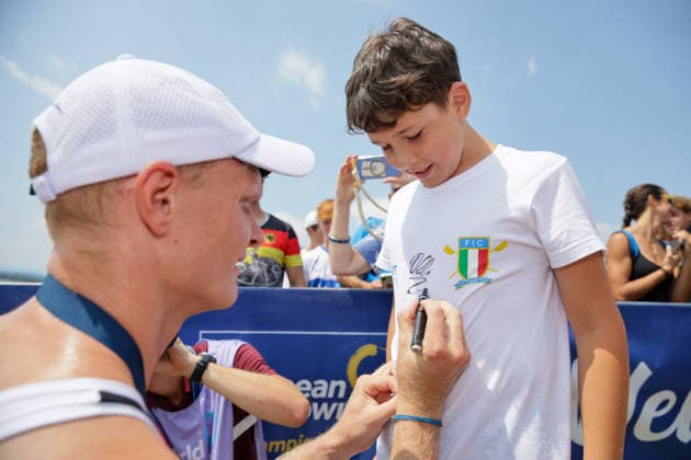 RECORD DATE NOT STATED 2nd August 2026; Lake Varese, Varese, Lombardy, Italy; 2026 European Rowing Championships, Day Three; the medal ceremony, Men& x2019;s Single Sculls (M1x), Germany gold medallists Oliver Zeidler signs an autograph AnthonyxBenoit