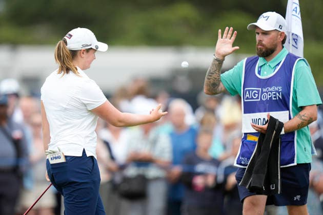 LYTHAM, ENGLAND - AUGUST 2: Lottie Woad (ENG) throws her ball to her caddie after she played from a green side bunker on the 6th hole during Round 4 at the 50th AIG Women™s Open Championship at the Royal Lytham and St Anne™s Golf Club, Lytham on August 2, 2026 in Lancashire, England The 50th AIG Women™s Open Championship