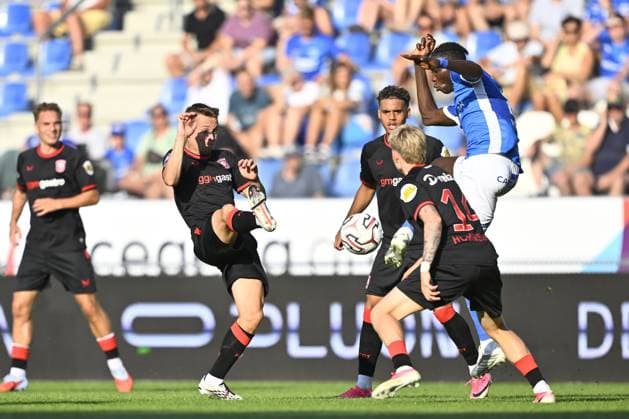 Twente s Mathias Kjolo and Genk s Ibrahima Sory Bangoura fight for the ball during a friendly soccer game between Racing Genk vs FC Twente, on Sunday 02 August 2026 in Genk, in preparation of the upcoming 2026-2027 Belgian first division soccer season. JOHAN EYCKENS JohanxEyckens  x182625340x