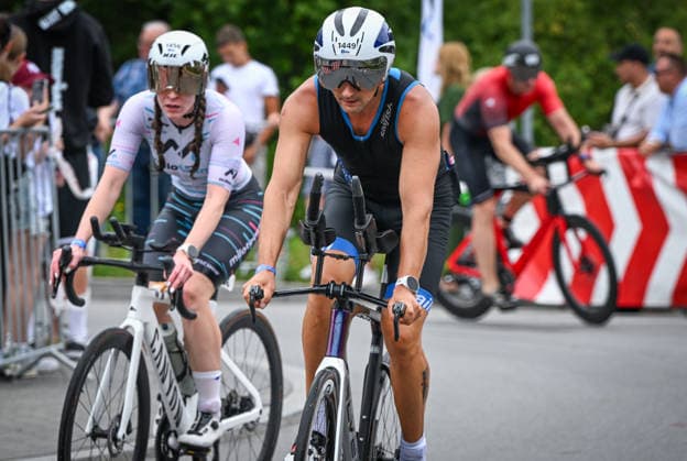 TRIATHLON: Stepniak And Bartlett Secure Elite Victories At IRONMAN 70.3 Krakow KRAKOW, POLAND - AUGUST 02: Triathletes focus on the road as they ride their bikes out of the transition area to begin the cycling leg during the Enea IRONMAN 70.3 Krakow triathlon in Krakow, Lesser Poland Voivodeship, Poland, on August 02, 2026. Over 2,100 registered competitors mounted their bicycles to embark on the 90-kilometer (56-mile) bike segment, navigating a high-speed route through the scenic Lesser Poland countryside. Krakow Poland  Copyright: xArturxWidakx originalFilename:widak-triathlo260802_npY4Q.jpg