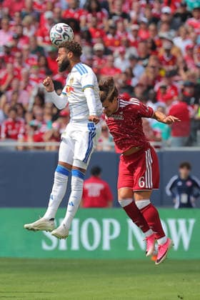 CHICAGO, IL - AUGUST 02: Jayden Bogle 2 of Leeds United heads the ball over Milos Kerkez 6 of Liverpool FC during a friendly match between Liverpool FC and Leeds United on August 2, 2026 at Soldier Field in Chicago, Illinois.(Photo by Melissa Tamez Icon Sportswire) SOCCER: AUG 02 Leeds United v Liverpool EDITORIAL USE ONLY Icon260802002