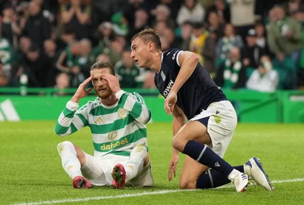Kasper Hogh of Celtic reacts after missing a scoring chance undwer pressure from Ryan Astley of Dundee, right. Celtic v Dundee, William Hill Scottish Premiership, Football, Celtic Park, Glasgow, Scotland, UK - 03 Aug 2026Glasgow Celtic Park Scotland United Kingdom  Copyright: xStuartxWallace Shutterstockx 17032193af