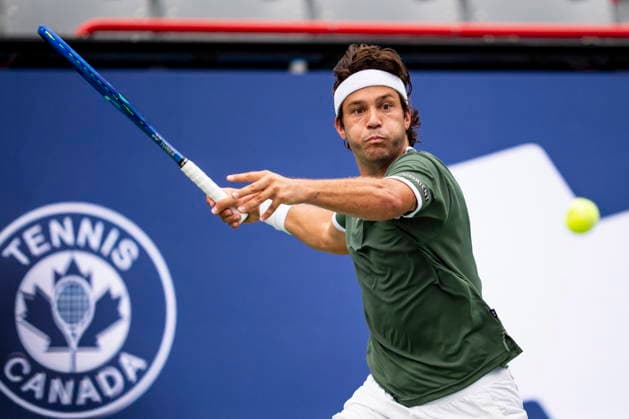 August 3, 2026, Montreal, Pq, Canada: Alexis Galarneau of Canada returns the ball during his first round match against Vit Kopriva, of Czechia, on day two of the National Bank Open tennis tournament in Montreal on Monday August 3, 2026. Canada News - August 3, 2026  - ZUMAc35_ 20260803_zaf_c35_007 Copyright: xChristopherxKatsarovx