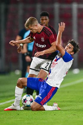 From left Martin Suchomel of Sparta and Mathys De Carvalho of Lyon in action during the 1st leg, 3rd qualifying round match of the Football Champions League between Sparta Praha and Olympique Lyon, on August 4, 2026, in Prague, Czech Republic. (CTKxPhoto OndrejxDeml) CTKPhotoP2026080406999  CTKPhotoP2026080406999