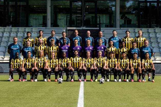 ARNHEM , 04-08-2026 , Nationaal Sportcentrum Papendal , season 2026 2027 , Dutch Keuken Kampioen Divisie football , Photocall , picture shows Vitesse squad with, back row L-R, Vitesse player Ayman Sellouf, Vitesse player Omar Achouitar, Vitesse performance coach Lars Smeenk, Vitesse assistant coach Timm Fahrion, Vitesse head coach Rudiger Rehm, Vitesse assistant coach Mike van Dijk, Vitesse goalkeeper coach Rein Baart, Vitesse physiotherapist Tijmen Gores, Vitesse player Koen te Veluwe, Vitesse player Eduard Probst, middle row L-R, Vitesse team manager Erwin Mulder, Vitesse kit manager Fabian van Drumpt, Vitesse player Valon Zumberi, Vitesse player Marcus Steffen, Vitesse goalkeeper Tyrick Bodak, Vitesse goalkeeper Connor van den Berg, Vitesse goalkeeper Maximilian Brull, Vitesse goalkeeper Jayden Siecker, Vitesse player Naoufal Bannis, Vitesse player Nathan Markelo, Vitesse video analyst Yuhao Zhang, Vitesse kit manager Leon Keijman, front row L-R, Vitesse player Solomon Bonnah, Vitesse player Youssef Ouallil, Vitesse player Chiel Olde Keizer, Vitesse player Mathijs Marschalk, Vitesse player Joao Pinto, Vitesse player Marco Schikora, Vitesse player Alexander Buttner, Vitesse player Nino Zonneveld, Vitesse player Yuval Ranon, Vitesse player Ricardo Schwarz, Vitesse player Filipe de Carvalho and Vitesse player Xiamaro Thenu pose for a teamphoto Photocall Vitesse  x205454880x Copyright: