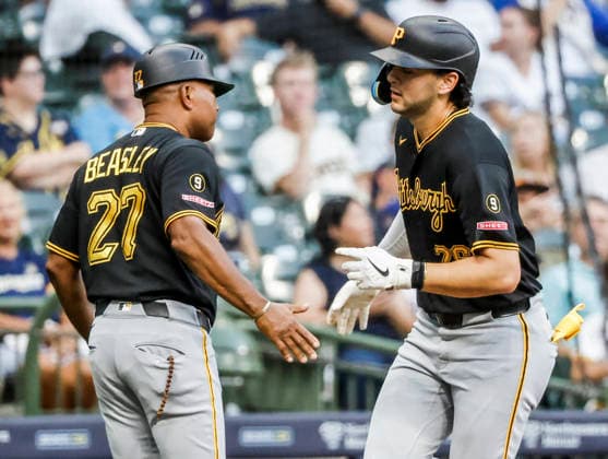 Pittsburgh Pirates shortstop Jacob Gonzalez (R) celebrates with Pittsburgh Pirates third base coach Tony Beasley after hitting a home run in the third inning of the MLB, Baseball Herren, USA game between the Pittsburgh Pirates and the Milwaukee Brewers at American Family Field in Milwaukee, Wisconsin on Tuesday, August 4, 2026.  MIL20260804808 TANNENxMAURY