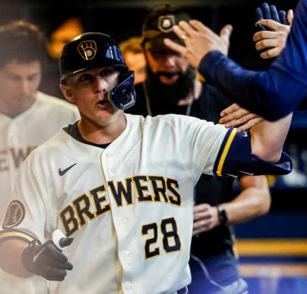 Milwaukee Brewers first baseman Andrew Vaughn celebrates in the dugout after hitting a home run in the fourth inning of the MLB, Baseball Herren, USA game between the Pittsburgh Pirates and the Milwaukee Brewers at American Family Field in Milwaukee, Wisconsin on Tuesday, August 4, 2026.  MIL20260804818 TANNENxMAURY