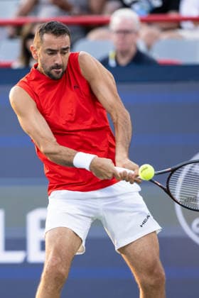 MONTREAL, QC - AUGUST 04: Marin Cilic from Croatia plays a backhand against Frances Tiafoe from USA during their singles second round match on day three of the ATP, Tennis Herren 1000 National Bank Open presented by Rogers at Stade IGA on August 4, 2026 in Montreal, Quebec, Canada. (Photo by Vincent Ethier Icon Sportswire) TENNIS: AUG 04 National Bank Open EDITORIAL USE ONLY Icon270804007