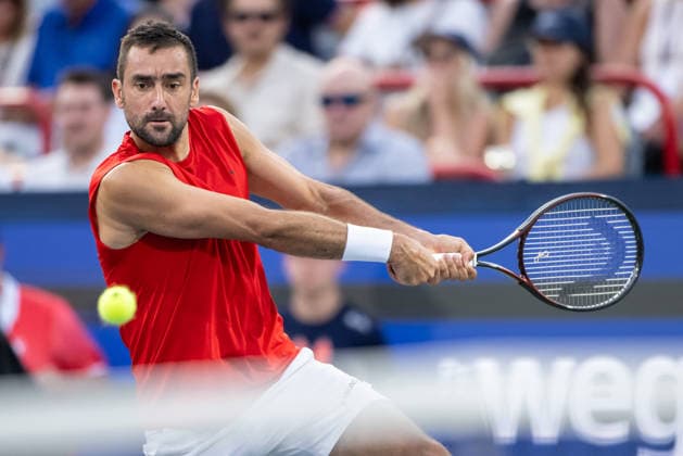 MONTREAL, QC - AUGUST 04: Marin Cilic from Croatia returns the ball against Frances Tiafoe from USA during their singles second round match on day three of the ATP, Tennis Herren 1000 National Bank Open presented by Rogers at Stade IGA on August 4, 2026 in Montreal, Quebec, Canada. (Photo by Vincent Ethier Icon Sportswire) TENNIS: AUG 04 National Bank Open EDITORIAL USE ONLY Icon270804045