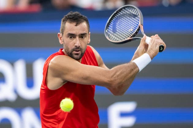 MONTREAL, QC - AUGUST 04: Marin Cilic from Croatia returns the ball against Frances Tiafoe from USA during their singles second round match on day three of the ATP, Tennis Herren 1000 National Bank Open presented by Rogers at Stade IGA on August 4, 2026 in Montreal, Quebec, Canada. (Photo by Vincent Ethier Icon Sportswire) TENNIS: AUG 04 National Bank Open EDITORIAL USE ONLY Icon270804055