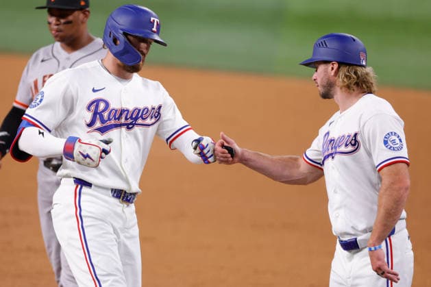 August 4, 2026, Arlington, Texas, USA: Texas Rangers right fielder BRANDON NIMMO (24) Texas Rangers first base coach TRAVIS JANKOWSKI (96)vin a baseball game, Tuesday, Aug. 4, 2026, in Arlington, Texas. Arlington USA - ZUMAa325 20260804_zsa_a325_025 Copyright: xDavidxBalleringxIix