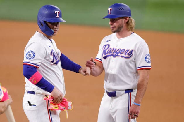 August 4, 2026, Arlington, Texas, USA: Texas Rangers first baseman JOC PEDERSON (3) and Texas Rangers first base coach TRAVIS JANKOWSKI (96) fist bump after a single by PEDERSON in a baseball game, Tuesday, Aug. 4, 2026, in Arlington, Texas. Arlington USA - ZUMAa325 20260804_zsa_a325_034 Copyright: xDavidxBalleringxIix