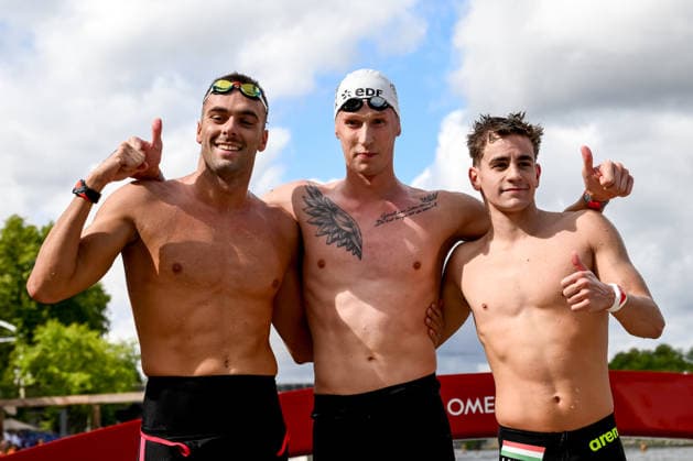 Gregorio Paltrinieri of Italy, bronze, Florian Wellbrock of Germany, gold, David Betlehem of Hungary, silver celebrate after the open water swimming 5km Men Final during the European Aquatics Championships at the River Seine in Paris (France), August 5, 2026. Andrea Staccioli