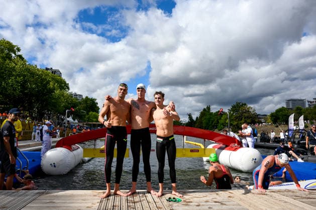 Gregorio Paltrinieri of Italy, bronze, Florian Wellbrock of Germany, gold, David Betlehem of Hungary, silver celebrate after the open water swimming 5km Men Final during the European Aquatics Championships at the River Seine in Paris (France), August 5, 2026. Andrea Staccioli