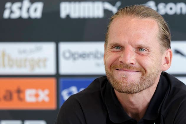 Trainer Eugen Polanski (Borussia Moenchengladbach) beantwortet bei der Pressekonferenz die Fragen der Journalisten waehrend des Trainingslagers von Borussia Moenchengladbach, Stadion Birkenmoos am 05. August 2026 in Rottach-Egern, Deutschland. (Foto von Marco Steinbrenner DeFodi Images) +++ Trainer Eugen Polanski (Borussia Moenchengladbach) answers journalists™ questions at the press conference, PK, Pressekonferenz during the Borussia Moenchengladbach Training camp at Stadion Birkenmoos on August 5, 2026 in Rottach-Egern, Germany. (Photo by Marco Steinbrenner DeFodi Images) (Photo by Marco Steinbrenner DeFodi Images) - *** Coach Eugen Polanski of Borussia Mönchengladbach answers journalists questions at a press conference during Borussia Mönchengladbach s training camp, Birkenmoos Stadium on August 5, 2026, in Rottach Egern, Germany. Photo by Marco Steinbrenner, DeFodi Images. Coach Eugen Polanski of Borussia Mönchengladbach answers journalists’ questions at the press conference during the Borussia Mönchengladbach training camp at Birkenmoos Stadium on August 5, 2026 in Rottach-Egern, Germany. Photo by Marco Steinbrenner, DeFodi Images. Photo by Marco Steinbrenner, DeFodi Images.
