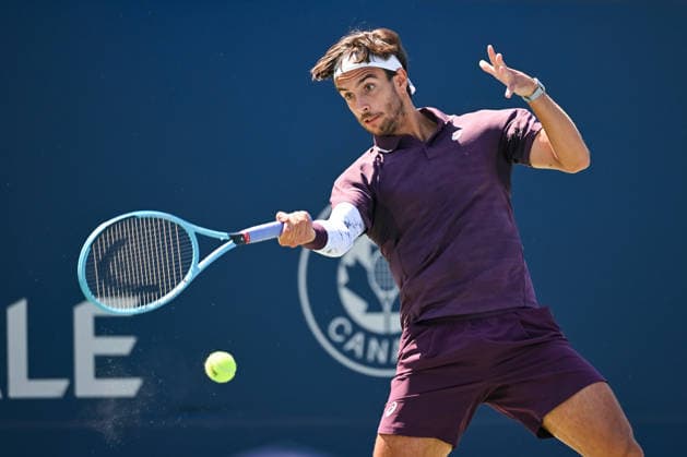 MONTREAL, QC - AUGUST 05: Lorenzo Musetti (ITA) returns the ball during a second round match at National Bank Open on August 05, 2026 at IGA Stadium in Montreal, QC (Photo by David Kirouac Icon Sportswire) TENNIS: AUG 05 National Bank Open EDITORIAL USE ONLY Icon26080501726