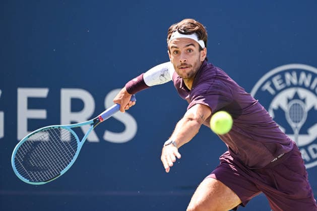 MONTREAL, QC - AUGUST 05: Lorenzo Musetti (ITA) returns the ball during a second round match at National Bank Open on August 05, 2026 at IGA Stadium in Montreal, QC (Photo by David Kirouac Icon Sportswire) TENNIS: AUG 05 National Bank Open EDITORIAL USE ONLY Icon26080502026