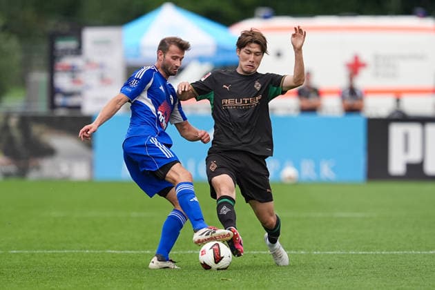 05.08.2026, xydrx, Fußball, Testspiel, FC Rottach-Egern - Borussia Mönchengladbach, Saison 2026 2027, Stadion am Birkenmoos: Florian Mex (FC Rottach-Egern, 9) im Zweikampf gegen Daiki Hashioka (Borussia Moenchengladbach, 14) DFB regulations prohibit any use of photographs as image sequences and or quasi-video. *** August 5, 2026, xydrx, Soccer, Friendly Match, FC Rottach Egern vs. Borussia Mönchengladbach, 2026–2027 Season, Birkenmoos Stadium, Florian Mex (FC Rottach Egern), No. 9 in a tackle against Daiki Hashioka (Borussia Mönchengladbach), No. 14. DFB regulations prohibit any use of photographs as image sequences and or quasi-video. Copyright: HMBxMedia YannisxDreimann